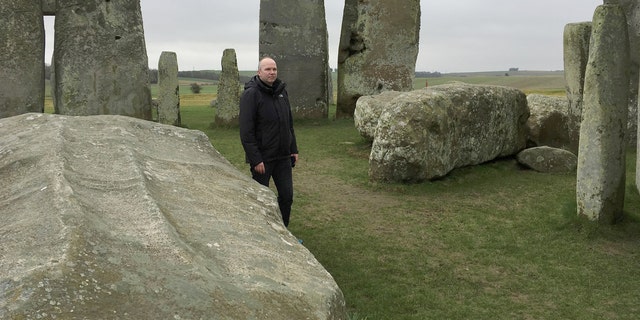File photo: Doctor Rupert Till, music technologist from the University of Huddersfield, poses for a photograph in the stone circle of the ancient monument of Stonehenge, Amesbury, Britain February 22, 2017. Till has co-developed an app that gives users a virtual acoustic tour of Stonehenge as it would have sounded thousands of years ago with all the stones in their original place, complete with soundtrack of Neolithic 'music'. (REUTERS/Matthew Stock)