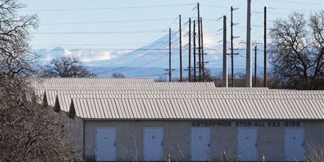 A commercial storage unit facility is shown Tuesday, Dec. 15, 2015, where two children were found dead in Redding, Calif. Autopsies were planned for the 3-year-old girl and 6-year-old boy, whose names were not released. No charges have been filed in their deaths. The investigation began with a call about a possible child abuse case in the small town of Quincy, about 220 miles northeast of San Francisco. (Andreas Fuhrmann/Record Searchlight via AP)