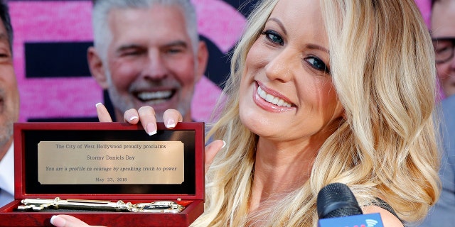 Stormy Daniels shows the Key during a ceremony for her receiving a City Proclamation and Key to the City on Wednesday, May 23, 2018 in West Hollywood, Calif.