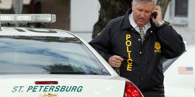 Jan. 24: St. Petersburg Police Chief Chuck Harmon talks on a cell phone as he walks from the scene where a U.S. Marshal and two St. Petersburg police officers were shot while trying to serve an arrest warrant in St. Petersburg, Fla. (AP)