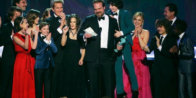The cast of Stranger Things accepts their award for Ensemble in a Drama Series during the 23rd Screen Actors Guild Awards in Los Angeles, California, U.S., January 29, 2017. REUTERS/Mike Blake - RTSXZD6