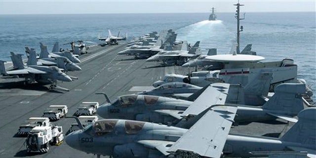 An airplane parked on the flight deck of USS Abraham Lincoln on this 2012 photo.