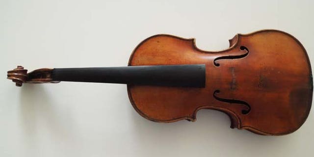 This handout photo provided by the FBI New York shows The Ames Stradivarius which was recovered by the FBI in June. Renowned violinist Roman Totenberg left his beloved Stradivarius in his office while greeting well-wishers after a concert in 1980. When he returned, it was gone.