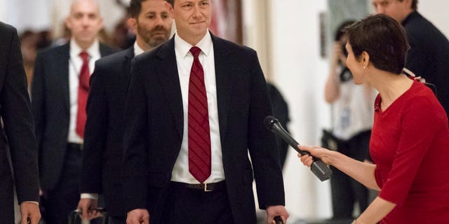 FILE - In this June 27, 2018, file photo, Peter Strzok, the FBI agent facing criticism following a series of anti-Trump text messages, walks to gives a deposition before the House Judiciary Committee on Capitol Hill in Washington. (AP Photo/J. Scott Applewhite, File)