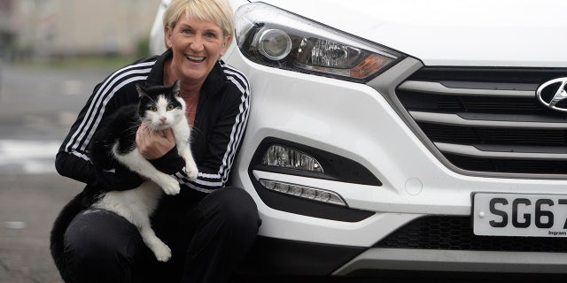 A relieved Sharon Stirling and her cat Jacob.