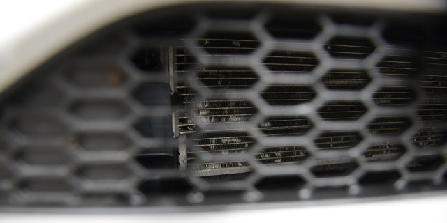 Minor damage possibly caused by Jacob can be seen on the car's radiator.