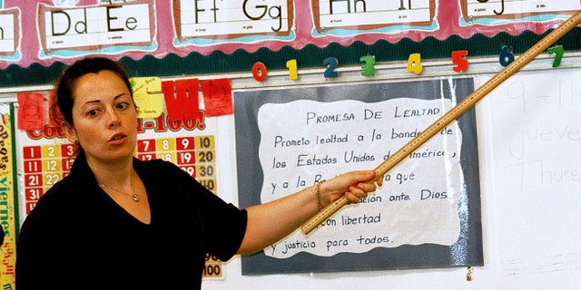 Lourdes Carmona, a Spanish speaking first grade teacher, instructs a class at Birdwell Elementary School in Tyler, Texas.