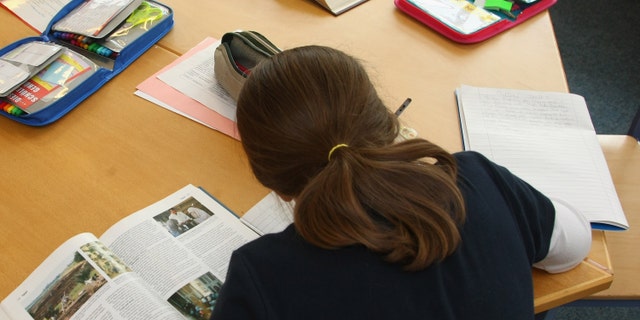 BERLIN - SEPTEMBER 18: A fourth-grade student works on homework in the elementary school at the John F. Kennedy Schule dual-language public school on September 18, 2008 in Berlin, Germany. The German government will host a summit on education in Germany scheduled for mid-October in Dresden. Germany has consistantly fallen behind in recent years in comparison to other European countries in the Pisa education surveys, and Education Minister Annette Schavan is pushing for an 8 percent increase in the national educaiton budget for 2009. (Photo by Sean Gallup/Getty Images)