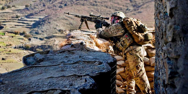 U.S. Army Sgt. Andrew Barnett armed with the M14 enhanced battle rifle outside an Afghan border police observation point in Kunar province, Afghanistan (U.S. Army photo by Sgt. Jon Heinrich)