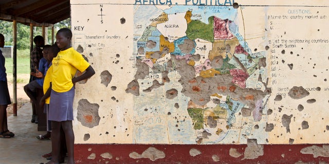 Nov. 15, 2016: Students line up outside a classroom with a map of Africa on its wall, in Yei, in southern South Sudan.