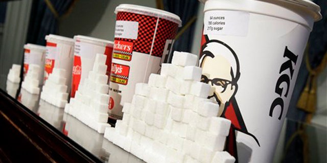 May 31, 2012: This photo shows a display of various size cups and sugar cubes at a news conference at New York's City Hall.