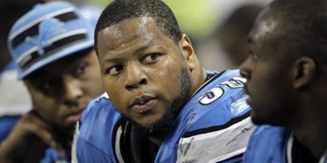 Nov. 20, 2011: FILE - In this file photo, Detroit Lions defensive tackle Ndamukong Suh (90) sits on the bench during the fourth quarter of an NFL football game against the Carolina Panthers, in Detroit.