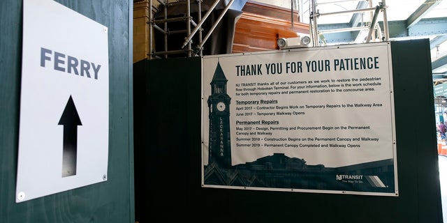 Signs at the Hoboken, N.J., train station direct New York bound passengers arriving on board New Jersey Transit trains to the ferry.