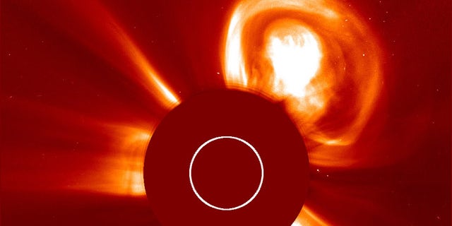A gigantic solar eruption shoots out from the sun -- straight towards the Red Planet.