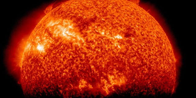 NASA's Solar Dynamics Observatory snapped this view of the sun fading into shadow as it slips behind the Earth from the spacecraft's vantage point on March 29, 2011. The image was taken during SDO's so-called eclipse season, when it flies behind Earth for up to 72 minutes of each day.
