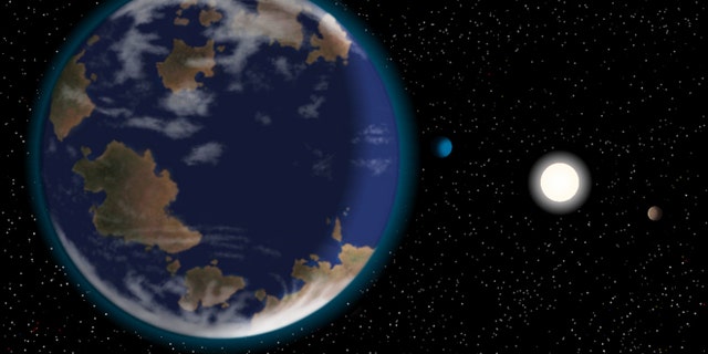 This artists impression shows the newfoun potentially habitable alien planet HD40307g in the foreground, with its host star and two other worlds in the six-planet system.