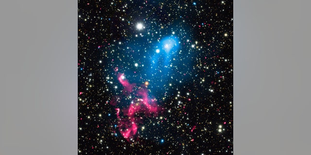 Particles ejected from a supermassive black hole are caught up in a galaxy merger, blasting the material even more powerfully into space. ( X-ray: NASA/CXC/SAO/R. van Weeren et al.; Optical: NAOJ/Subaru; Radio: NCRA/TIFR/GMRT)