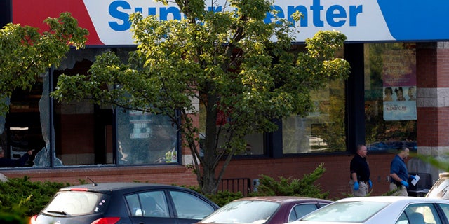 Aug. 31, 2012: Officials investigate the scene of a shooting at a Pathmark grocery store in Old Bridge, N.J. At least three people have died in the shooting. A law enforcement official briefed on the shooting says the person believed to be the shooter is among the dead. (AP)