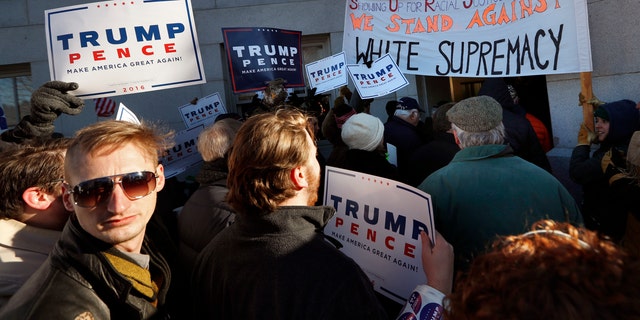 Trump supporters and protesters face off in Maine on Dec. 19.