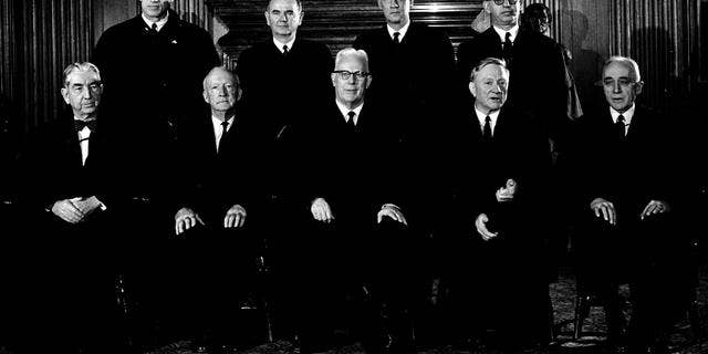 Chief Justice Earl Warren and the eight Associate Justices of the Supreme Court are shown on Nov. 19, 1962 in Washington. From left, seated: Associate Justices Tom C. Clark and Hugo L. Black ; Chief Justice Earl Warren ; Associate Justices William O. Douglas and John M. Harlan. From left, Standing: Associate Justices Byron R. White, William J. Brennan, Jr., Potter Stewart and Athur J. Goldberg. (AP Photo)