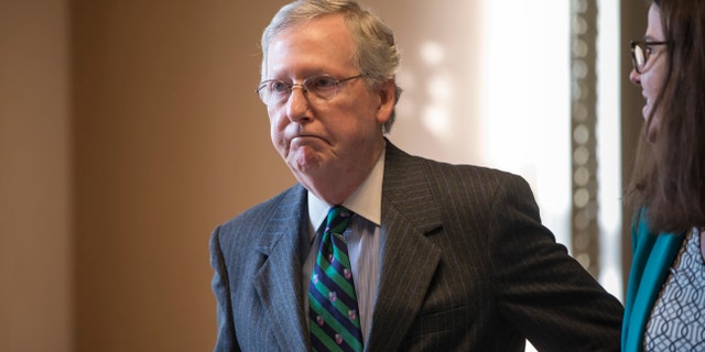 Feb. 22, 2016: Senate Majority Leader Mitch McConnell walks to his office from the chamber where he offered a tribute to the late Supreme Court Justice Antonin Scalia whose death has triggered an election-year political standoff, on Capitol Hill in Washington.