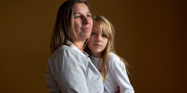 Nov. 14, 2014: Peggy Young, of Lorton, Va., with her daughter Triniti, 7, in Washington.
