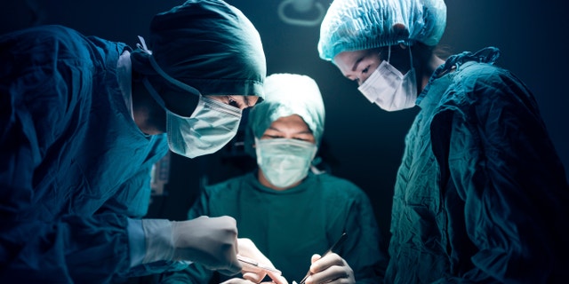surgeons in surgery istock large