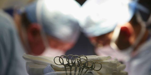 BIRMINGHAM, UNITED KINGDOM - JUNE 14: Surgeons at The Queen Elizabeth Hospital Birmingham conduct an operation on June 14, 2006, Birmingham, England. Senior managers of the NHS have said that the organisation needs to become more open in the future. (Photo by Christopher Furlong/Getty Images)