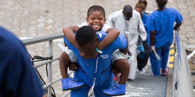 In September, nurses carried 11-year-old Justine up the gangway of Mercy Ships, a charity-run hospital ship that delivers free health care to less developed parts of the world.