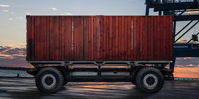A rendering of the Silent Utility Rover Universal Superstructure (SURUS) platform with shipping containers to show the potential of flexible fuel cell solutions. SURUS was designed to form a foundation for a family of commercial vehicle solutions that leverages a single propulsion system integrated into a common chassis.