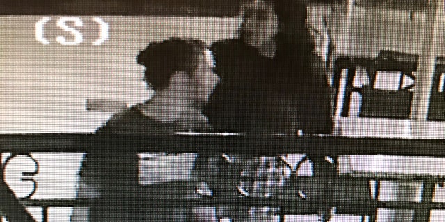 Surveillance footage from outside the Birchwood Inn, owned by Chuck Prather, shows two people posting the fliers.