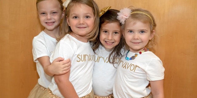 The four friends, who first met in 2016 while undergoing treatment, reunited for the touching photo during Childhood Cancer Awareness month.