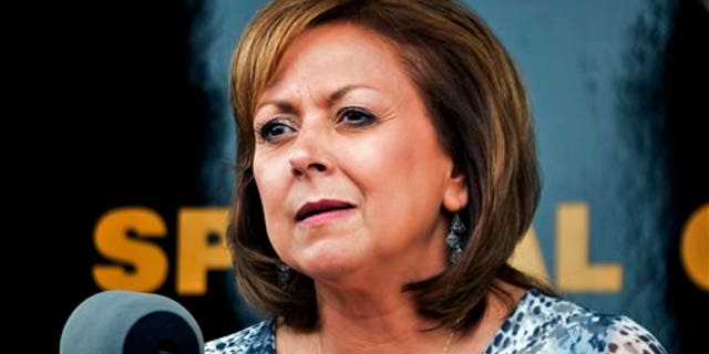 FILE - In this Sept. 4, 2015 file photo, New Mexico Gov. Susana Martinez speaks at a news conference in Albuquerque. Martinez finally got lawmakers to pass her long-sought revision of a state law that grants drivers licenses to immigrants in the country illegally. (AP Photo/Russell Contreras, File)