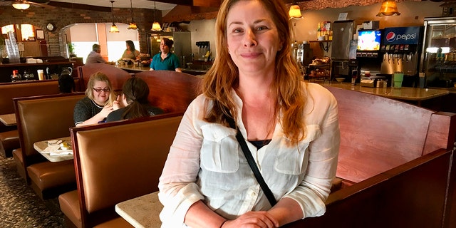 Diane Neal poses at a diner Wednesday, May 2, 2018, during an interview in Kingston, N.Y., discussing her campaign for the 19th congressional district. The former "Law and Order" actress is seeking a new gig as representative of a sprawling congressional district in upstate New York.(AP Photo/Mary Esch)
