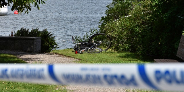In this Tuesday, July 31, 2018 photo, a discarded bicycle near the scene of a robbery at the Strangnas Cathedral, in Strangnas, Sweden.