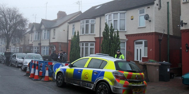 Dec. 13: A British police officer stands outside a property after it was searched in Luton, England. Two people were wounded in central Stockholm on Saturday in what appeared to be the first suicide bombing in the history of Sweden, which has been spared the major terrorist strikes seen in several other European countries. The alleged bomber lived in Luton and studied at the University of Bedfordshire. No arrests had been made and no hazardous materials were found at the property, authorities said. (AP)