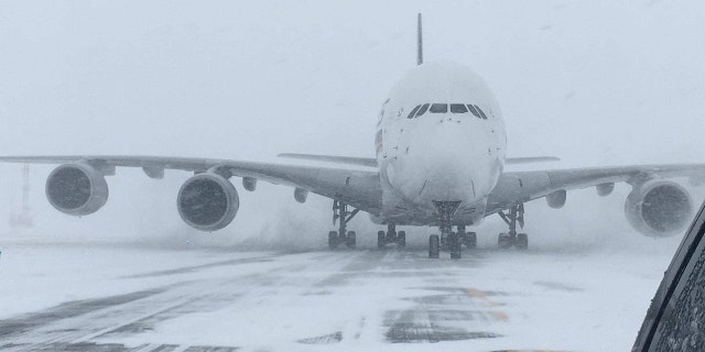 The world's largest passenger plane, a Singapore Airlines Airbus A380, was forced to land at Stewart International Airport on Thursday due to blizzard conditions.