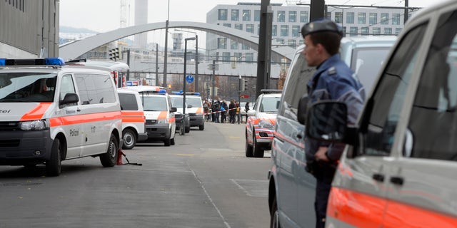 Dec. 4, 2014: Police cars wait outside the Zurich, Switzerland, university of art.