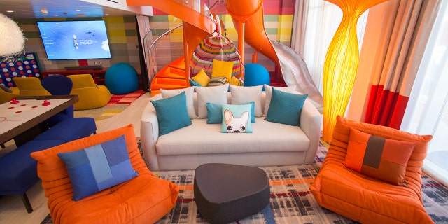 A staircase — and a slide — connect the lower level of the Ultimate Family Suite with the top.