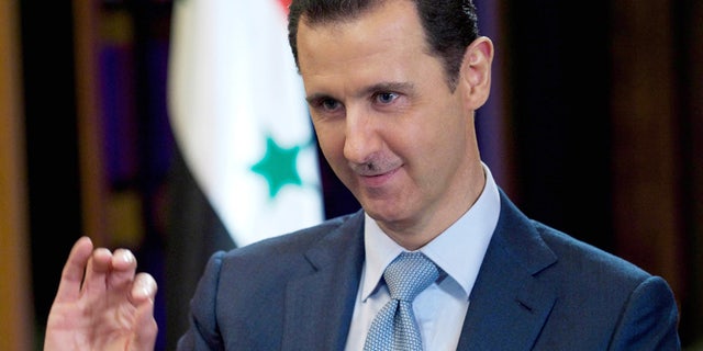 In this Feb. 10, 2015, file photo released by the Syrian official news agency SANA, Syrian President Bashar Assad gives an interview with the BBC in Damascus, Syria