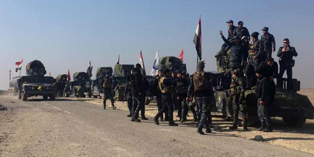 Iraqi federal police forces advance towards the western side of Mosul, Iraq.