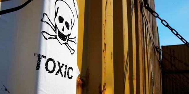 May 13, 2014: A sticker reading "Toxic" on containers carrying Syria's dangerous chemical weapons, on the Danish cargo ship, Ark Futura, transporting the chemical weapons out of the strife-torn country, in Cyprus coastal waters. (AP)