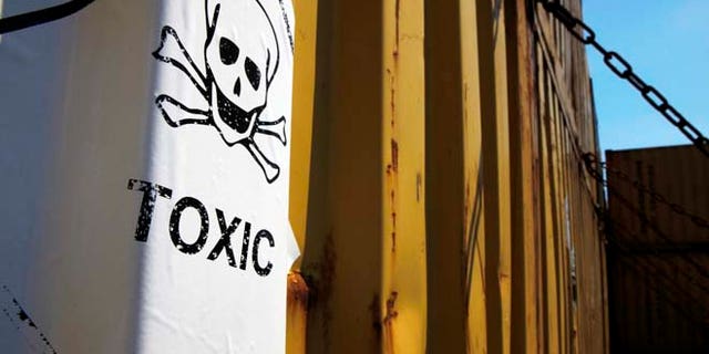 May 13, 2014: A sticker reading "Toxic" on containers carrying Syria's dangerous chemical weapons, on the Danish cargo ship, Ark Futura, transporting the chemical weapons out of the strife-torn country, in Cyprus coastal waters. (AP)