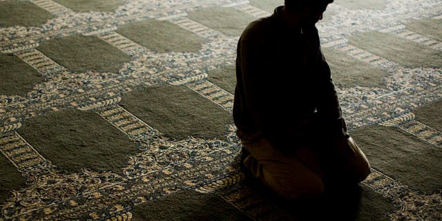 Nov. 18, 2015-- A Syrian refugee--photographed on condition of anonymity due to fear of retaliation against family living in Syria-- prays at the Muslim Association of Lehigh Valley in Whitehall, Pa. Dozens of Syrian refugee families have resettled in the Allentown, Pa., area, home to 1 of the nation's largest population of Syrians. (AP)