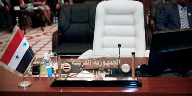 March 28,2012: The empty seat of the Syrian Foreign Minister is seen during the meeting of Arab Foreign Ministers in Baghdad, Iraq.