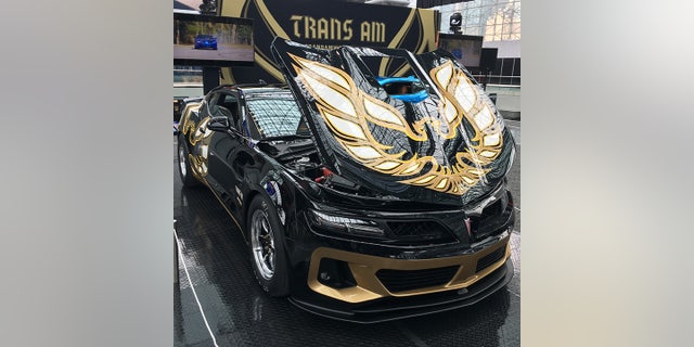 Carbon fiber bodywork transforms the Chevy into an alternate universe version of a Pontiac.