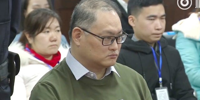 In this image taken from video released on Nov. 28, 2017, by the Intermediate People's Court of Yueyang, Taiwanese activist Lee Ming-che sits during a court session at the Intermediate People's Court of Yueyang in Yueyang in central China's Hunan Province, Tuesday, Nov. 28, 2017.