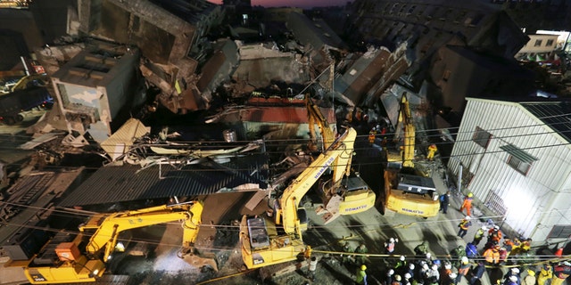 Feb. 8, 2016: Emergency rescue workers continue to search the rubble of a collapsed building complex in Tainan, Taiwan.