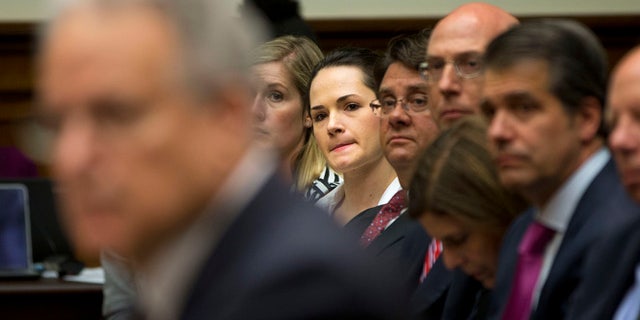 June 2, 2015: Angelina Sujata, center, a victim of a defective Takata airbag, listens to testimony on Capitol Hill in Washington.