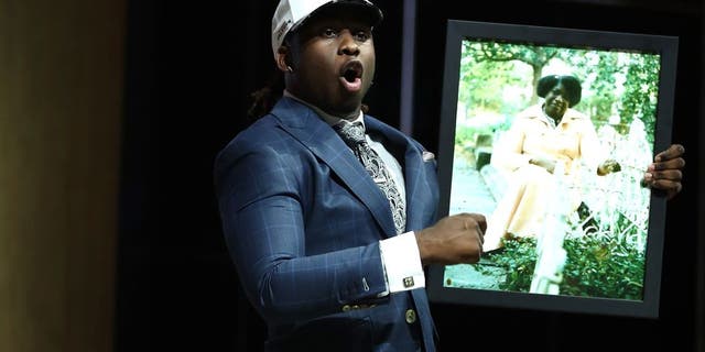 PHILADELPHIA, PA - APRIL 27: Takkarist McKinley of UCLA reacts after being picked #26 overall by the Atlanta Falcons during the first round of the 2017 NFL Draft at the Philadelphia Museum of Art on April 27, 2017 in Philadelphia, Pennsylvania. (Photo by Elsa/Getty Images)
